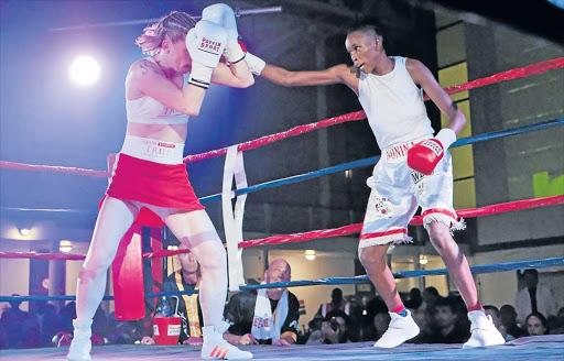 IN CONTROL: Bukiwe Nonina, right, throws a right to the head of German fighter Alesia Graf during their World Boxing Foundation (WBF) bantamweight OR Tambo Hall, Khayelitsha, Cape Town over the weekend. Nonina emerged victorious Picture: MLONDOLOZI MBOLO