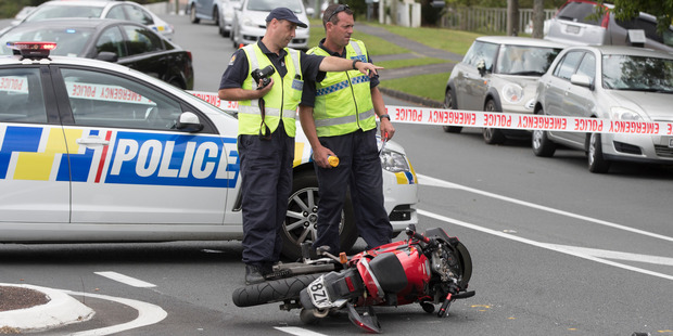 Police investigators at the crash scene on the corner of Archers Rd and Coronation Rd in Glenfield, Auckland, yesterday. Photo / Brett Phibbs