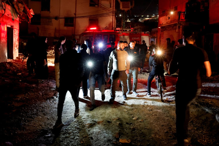 Palestinians inspect the damage after an Israeli raid in Jenin refugee camp in the Israeli-occupied West Bank, November 9 2023. Picture: RANEEN SAWAFTA/REUTERS