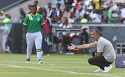 Orlando Pirates coach Jose Riveiro and his Golden Arrows counterpart Mabhudi Khenyeza with during the DStv Premiership match at Orlando Stadium on January 14 2022.