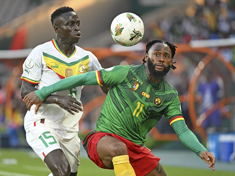 Georges Kevin Nkoudou Mbida of Cameroon is challenged by Krepin Diatta of Senegal during their Africa Cup of Nations clash at Charles Konan Banny Stadium in Yamoussoukro.