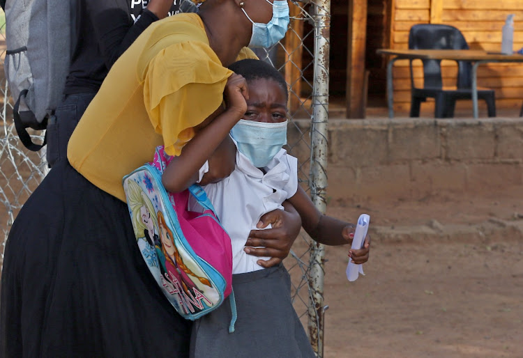 A little girl's first day at school at Tolamo Primary School in Letlhakaneng in the North West.