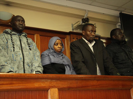 AP officers Fredrick Leliman, Leonard Mwangi, Silvia Wanjiku and Stephen Cheburet at Milimani law courts during a past hearing.