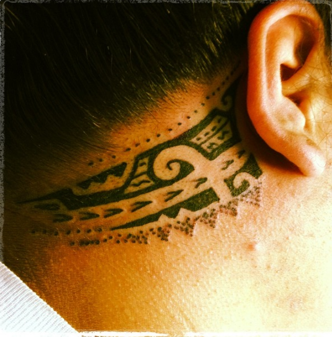 Behind the ear tattoo