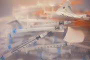 Syringes used to administer doses of the Pfizer-BioNTech vaccine against Covid-19 are pictured in a container. File photo.