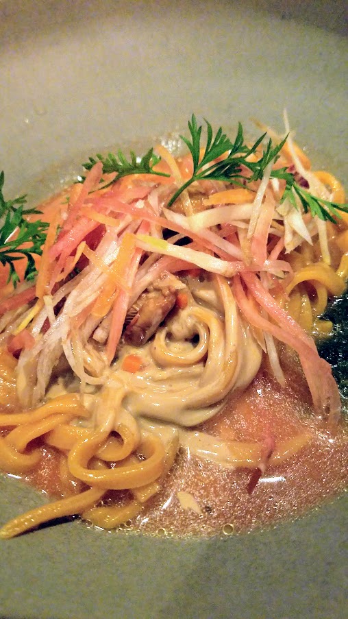 Carrot 'Ma Jiang Mian', a cold noodle dish with mustard greens, chanterelle, sesame, bergamot that has nutty flavors.  At Mister Jiu's in Chinatown, San Francisco