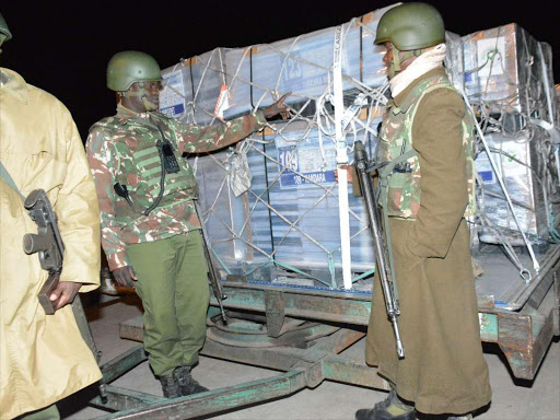 Police officers man ballot papers for the August 8 election after they were offloaded from a Saudi Cargo Plane at JKIA on the night of July 19. /PATRICK VIDIJA