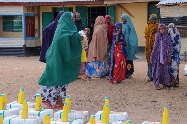 Residents of Maalimin in Lagdera line up to receive their share of relief food courtesy of the Garissa government on Wednesday.