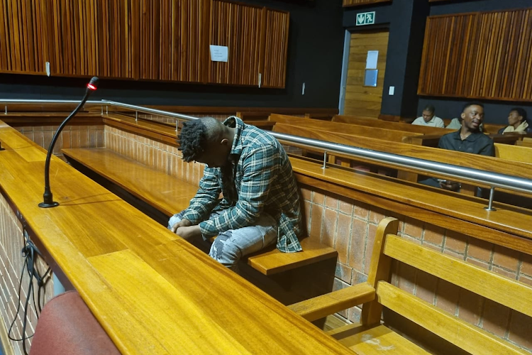 Flavio Hlabangwane keeps his head down in court.