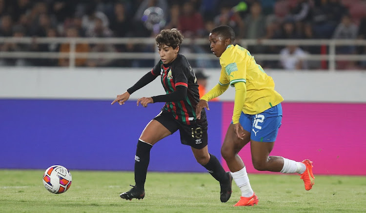 Doha Ahmamou of AS FAR tries to evade the challenge of Bambanani Mbane of Mamelodi Sundowns in 2022 Caf Women's Champions League final at Prince Moulay Abdallah Stadium in Rabat, Morocco on November 13 2022.