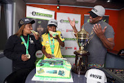 Banyana Banyana head coach Desiree Ellis and striker Noxolo Cesane enjoying a celebratory cake with the Marawa Sports Worldwide team.