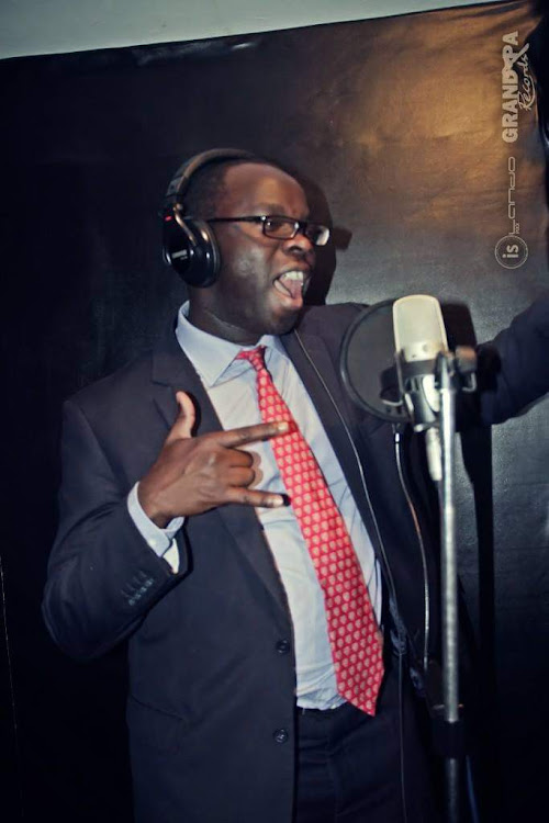 Kibra MP Ken Okoth inside the booth at Grandpa Records studio.