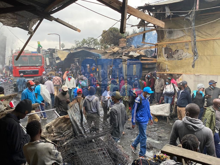 Gikomba traders salvaging what is left after the morning inferno on August 6, 2021.