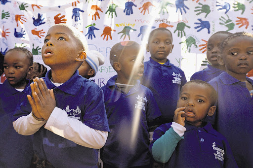 Children leave messages of support for former President Nelson Mandela outside the hospital in Pretoria at which he is being treated. President Jacob Zuma confirmed on Sunday that Mandela's condition has become critical. He was admitted to the hospital more than two weeks ago with a recurring lung infection