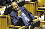 Former president Jacob Zuma laughing in parliament.