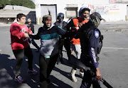 Protesters in Hangberg, Hout Bay, clash with police on June 23 2020 amid a dispute over payments for west coast rock lobster.