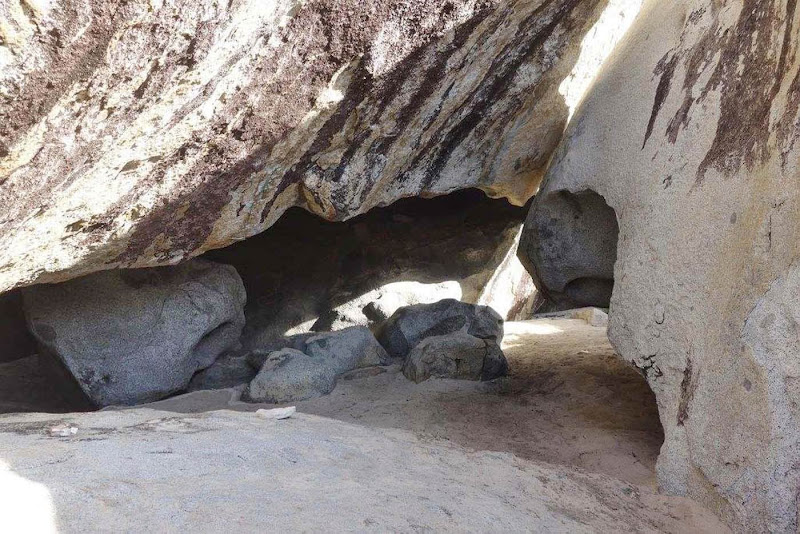 Shimmy time! A tight squeeze at The Baths in Virgin Gorda.