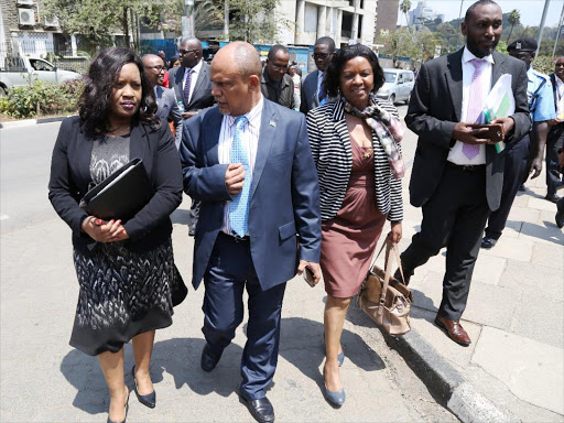 IEBC Deputy Commission Secretary Betty Sungura- Nyabuto Commissioners Mohamed Alawi, Muthoni Wangai and Director Finance Osman Hassan Ibrahim walk along Parliament Road after appearing before the Parliamentary Select Joint Committee yesterday. PHOTO / HEZRON NJOROGE