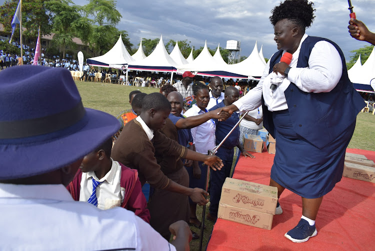 Homa Bay woman representative Joyce Osogo with some teachers and students at Gendia High School in Karachuonyo on April 14,2023