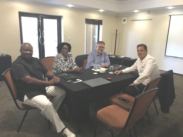 TIME TO TALK: UDM party leader Bantu Holomisa, left, with the party's treasurer general Thandie Nontenja, and the DA's James Selfe and party leader John Steenhuisen, right