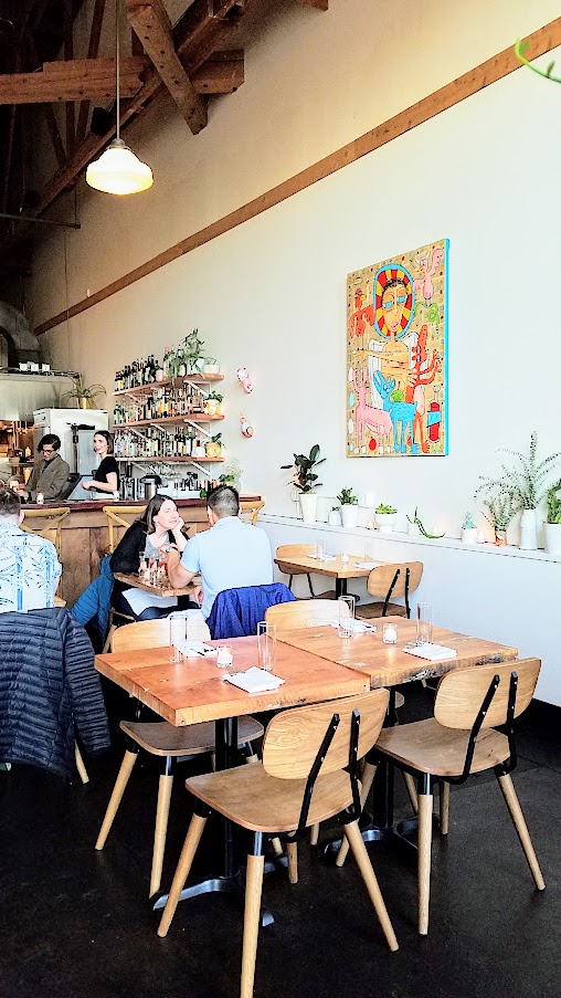 Dining at Delores PDX: The art you'll find along the walls is from his personal collection, and also reflects his mother's love of flamingos.