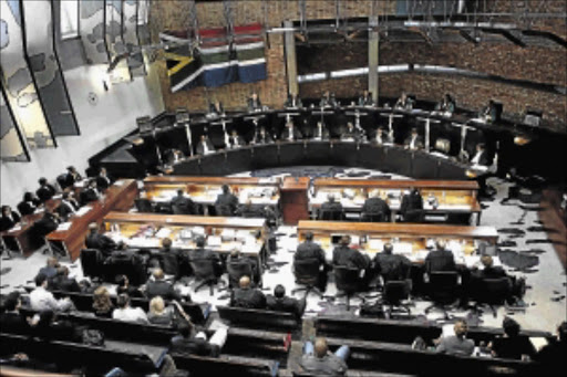 CHALLENGES: South African Constitutional Court judges listening to arguments. The writer says South Africa has one of the most progressive constitutions in the world and asks what stops the country from implementing it to the letter to advance its national agendaPhoto: LEBOHANG MASHILOANE