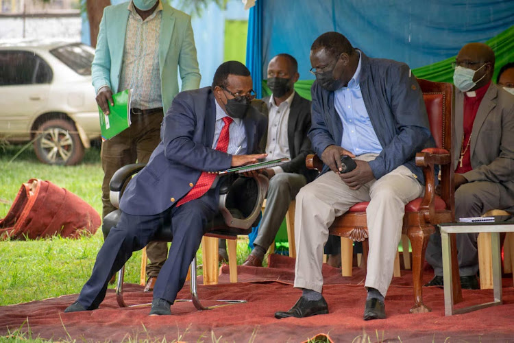 Health executive Joseph Murega chats with Governor James Nyoro during the launch of Kiambu's Family Planning Casted Implementation Plan 2022-2025 at the county government headquarters on Tuesday, December 21.