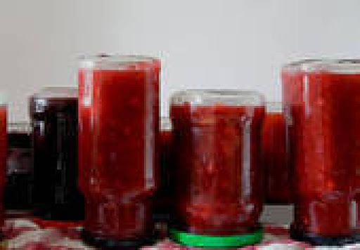 Strawberry Jam bottles reversed to settle and set.