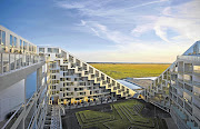 FUTURISTIC: Above, VM Houses in Ørestad, Denmark. Below left, 8Tallet, also designed by Bjarke Ingels