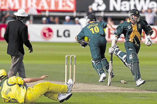 Proteas batsmen Lance Klusener, right, and Allan Donald meet at one end before the latter is run out in the World Cup semifinal against Australia at Edgbaston on June 17 1999 with the scores tied.