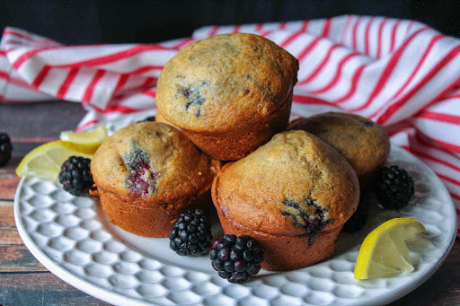 A plate of Brown Sugar Blackberry Muffins.