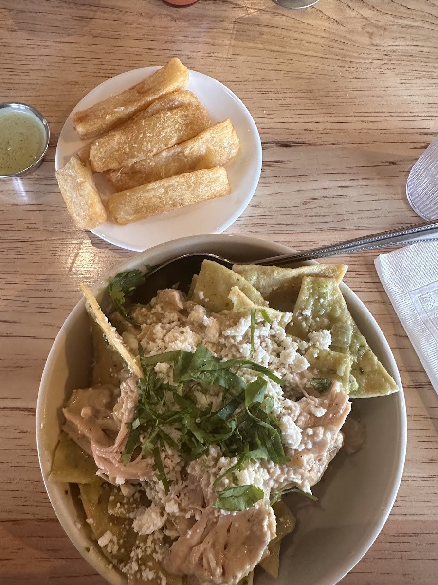 Smothered chicken bowl with salsa Verde, side of crispy yucca