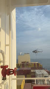 An official slides down a rope during a helicopter raid on MSC Aries ship at sea in this screen grab obtained from a social media video released on April 13 2024.