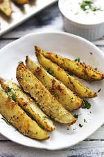 Baked Garlic Parmesan Potato Wedges was pinched from <a href="http://lecremedelacrumb.com/2015/04/baked-garlic-parmesan-potato-wedges.html" target="_blank">lecremedelacrumb.com.</a>