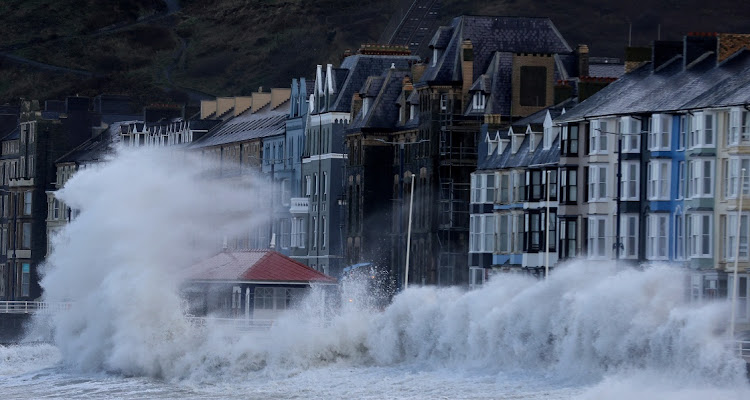 Waves caused by Storm Eunice break over Aberystwyth promenade in Aberystwyth, Wales on February 18 2022. Picture: REUTERS/CARL RECINE