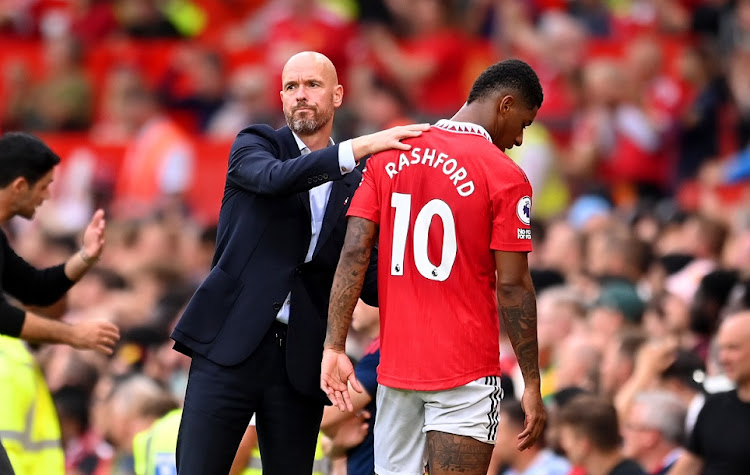 Manchester United manager Erik ten Hag congratulates double scorer Marcus Rashford during the Premier League match against Arsenal at Old Trafford in Manchester on September 4 2022.