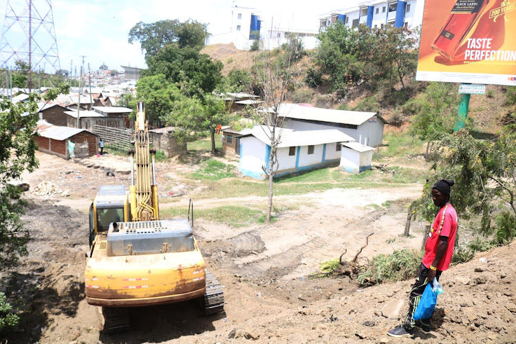 A bulldozer parked next to structures that will be demolished to pave way for construction of the new Sh4.5 billion Makupa Bridge.