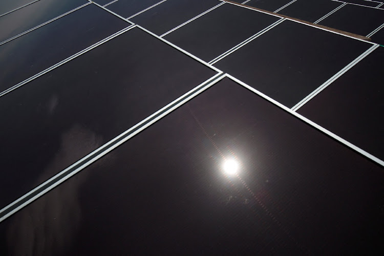 Solar panels sit on the roof of a building in the Hong Kong Electric Lamma island power plant July 29 2010. File Picture: REUTERS/Tyrone Siu/File Photo