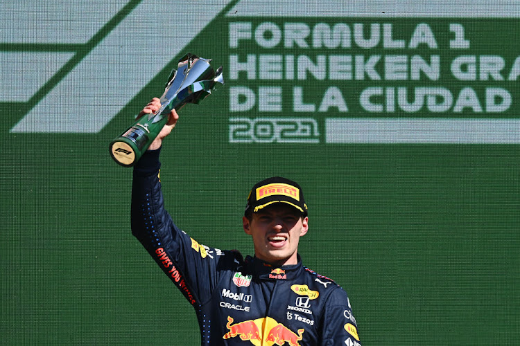 Race winner Max Verstappen celebrates on the podium during the F1 Grand Prix of Mexico at Autodromo Hermanos Rodriguez on November 07, 2021 in Mexico City, Mexico.