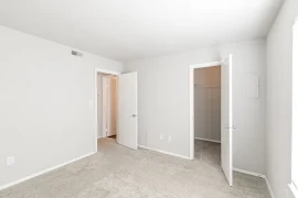 Bedroom looking towards closet and main entrance door