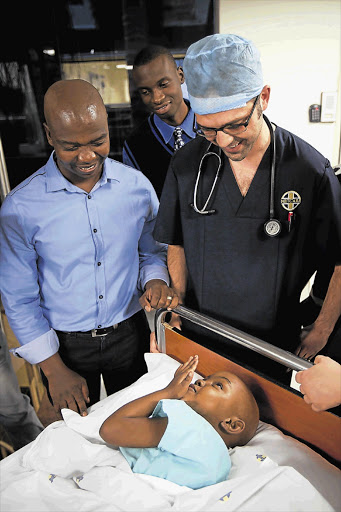 Five-year-old Celiwe Maseko hours before undergoing surgery at Netcare Garden City Clinic to replace her skin