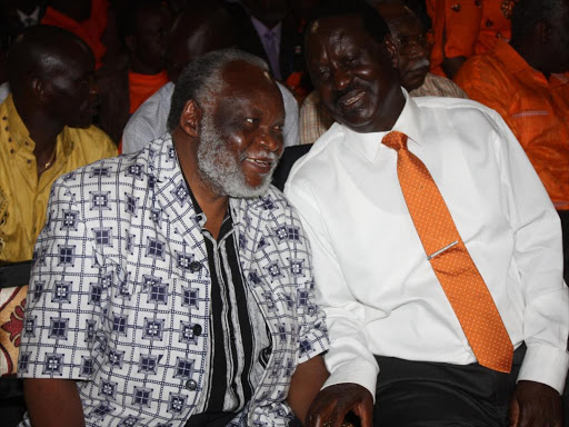 ODM leader Raila Odinga and Migori Senator Wilfred Machage during a Sunday service at Kehancha Catholic Church on October 21, 2012. /FILE