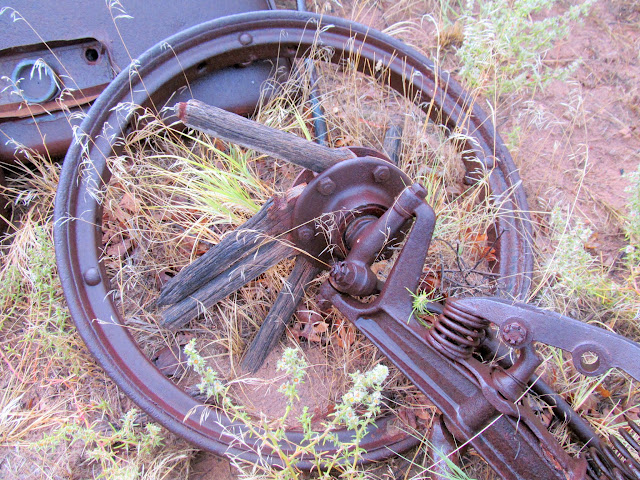 Wooden spoked wheel on an old car axle