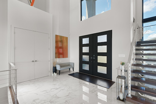 Modern entryway, glass-paned black doors in this luxury house for sale in Edmonton ($2,117,153)