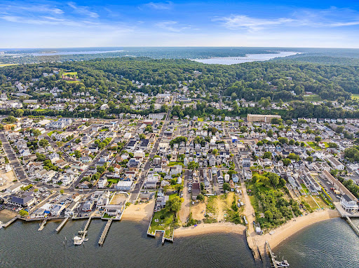 Aerial view of a tree-lined coastal town in this luxury house for sale in Highlands ($1,175,000)