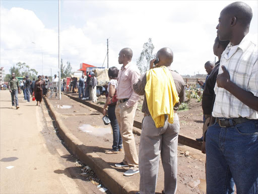 Stranded passengers along thika road after matatu entered their 2nd day of strike.pic\Charles kimani