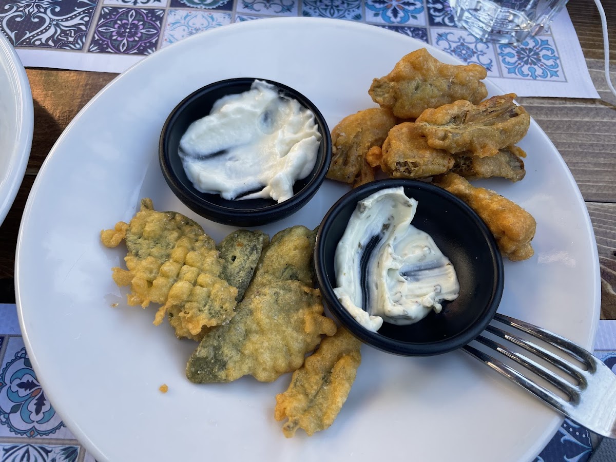 Fried artichokes with paprika covered on chickpea batter and fried sage covered on chickpea batter