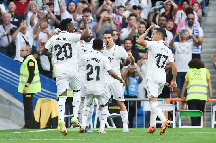 Real Madrid's players celebrate during a La Liga match against Almeria on April 29