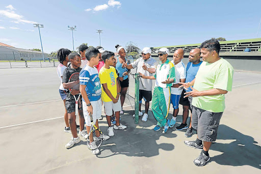 TRANSFORMATION TUSSLE: Tennis officials and selectors pose for a photograph at Selborne Park tennis courts with some of the players who were left out of the squad that played in Pretoria the past week. With the players are, from centre left, David Kempele (coaches convenor), Claude Moonieyan (Tennis Buffalo City secretary), Thabo Gwegwana (schools team convenor), Camagu Sotyelelwa (junior committee convenor) and Neil Naidoo (Tennis Buffalo City president) Picture: ALAN EASON