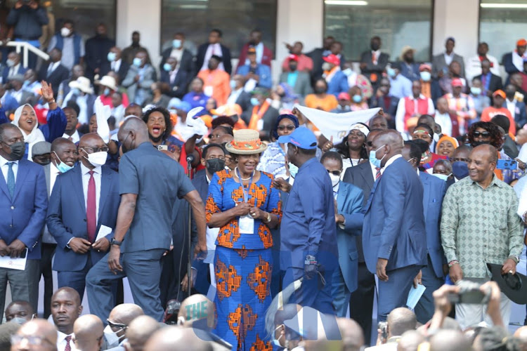 ODM Leader Raila Odinga greets Kitui Governor Charity Ngilu when he arrived at Kasarani on December 10, 2021.